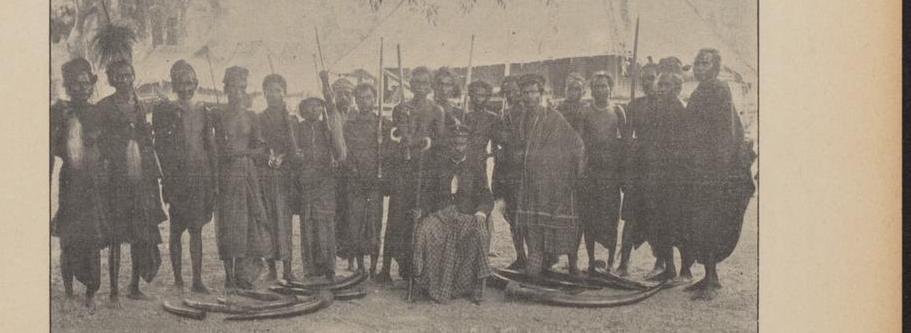 King of Sika surrounded by some of his warriors, photographed by Jesuit missionary Antonius Ijsseldijk in 1899.